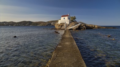 A long pier connects the mainland with a small church on a rock in the sea, chapel, church, Agios
