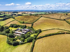 DefaultFarms and Fields over Torquay from a drone, Devon, England, United Kingdom