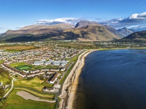 View of Caol Beach and Nevis Range Mountains from a drone, Corpach, Fort William, Highland,