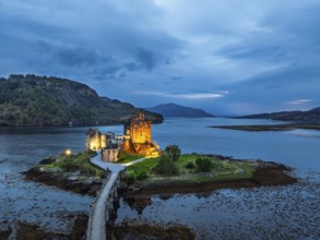 Night over Eilean Donan Castle and Loch Duich from a drone, Isle of Skye, Highlands, Scotland,