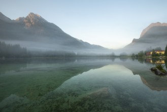 Magical sunrise with fog at Hintersee near Ramsau in Berchtesgadener Land