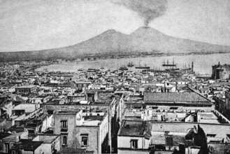 Cityscape of Naples with the smoking Vesuvius volcano, Gulf of Naples with sailing ships at anchor,