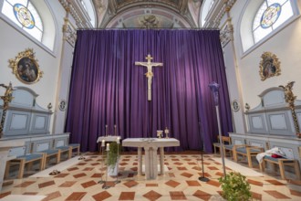 Large purple Lenten cloth in front of the high altar in the baroque parish church of St Nicholas,