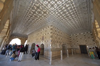 Visitors in the audience hall in the Amber Fort or fortress, Jaipur, Rajasthan, India
