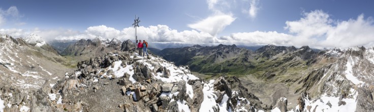 Mountain panorama, two female mountaineers at the summit of the Keeskopf with summit cross, behind
