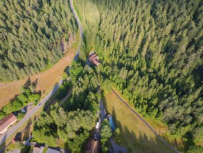 Bird's eye view of a winding road and green forests with a slight incline, Retro Freizeitpark