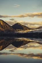 Sunrise with reflections and alpenglow in Lake Heiterwanger See in Tyrol in the Alps in Austria