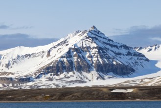 Mountain peaks, sedimentary rocks, snow, sea, Spitsbergen, Svalbard