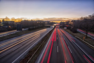 Motorway A96 at dusk and night with coloured lanes of moving cars. Munich, Bavaria, Germany
