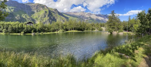 View of small picturesque romantic mountain lake Lago Grande near Moncenisio in Val Cenischia in