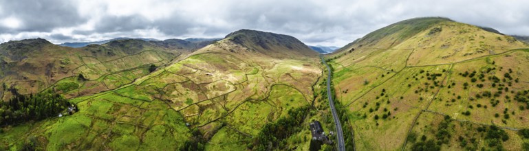 Panorama of Mountains over road A591 from a drone, Grasmere Lake, Grasmere, Ambleside, Lake