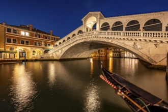 Rialto Bridge and gondolas on the Grand Canal, blue hour, long exposure, Venice, Veneto, Italy