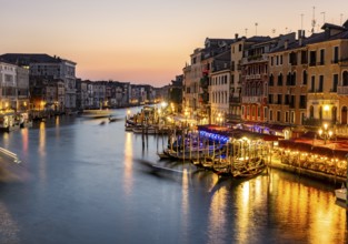 View of the Grand Canal at the blue hour, picturesque evening mood with illuminated palazzos on the