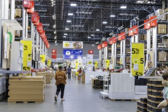 Customers shopping in the warehouse section of IKEA home store