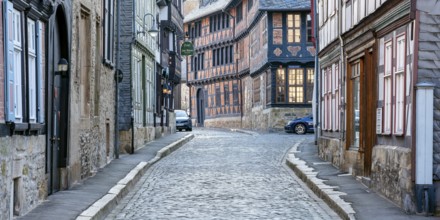 Alley with half-timbered houses and cobblestones in the historic old town, behind the Siemens