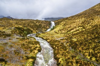 Eas a' Bhradain waterfall, Red Cuillin mountains, Loch Ainort, Isle of Skye, Scotland, UK