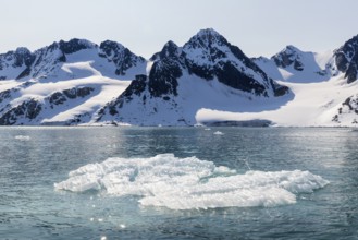 Mountain peaks, snow, sea, Fugelfjorden, Spitsbergen, Svalbard