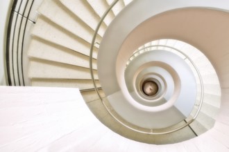 Modern white spiral staircase in an educational building, Zurich, Switzerland