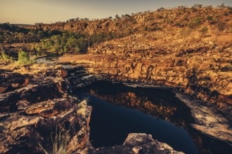 Bell Gorge waterfall, a body of water in north-west Australia in the Kimberley. Sunrise in the