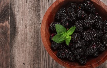 Blackberries, in a wooden bowl, top view, no people