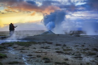 Walkers, sulphur vapour, fumarole, solfataras in the Hveravellir geothermal area, sunset, Icelandic