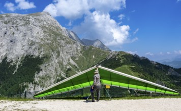 Paragliders preparing for flight, Jenner, Schönau am Königssee, Bavaria, Germany