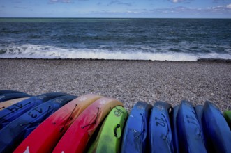 Kayaks, boats, colourful, lying on the beach, pebble beach, Étretat, sea, Normandy, Seine-Maritime,
