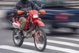 Man riding a motorcycle, Riding at high speed, Photo with motion blur, City of Quito, Pichincha