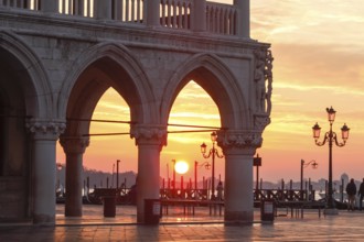 Sunrise at the Piazzetta in the morning during the Acqua alta, Venice, Veneto, Italy