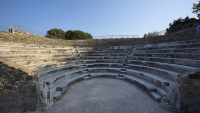 Ancient amphitheatre with massive stone steps and blue sky in the background, Ancient Theatre,