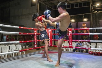 Thai boxing Muai Thai boxer in action, Pattaya, Thailand