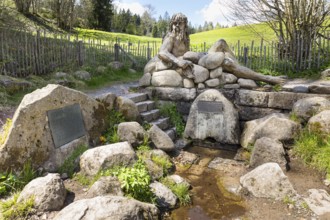 Figure of the river god Danuvius by sculptor Wolfgang Eckert at the source of the Breg, source of