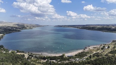 Aerial view of the Chronicle of Georgia with the Tbilisi Sea in the background