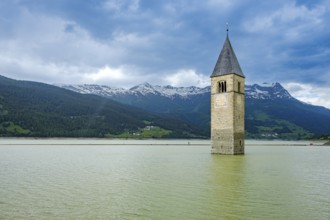 Bell tower of the former parish church of St Catherine in the sunken village of Alt-Graun in Lake