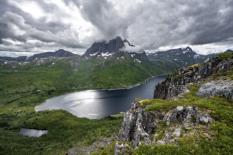 View of Mefjorden fjord from Barden mountain, Breidtind mountain peak behind, Senja, Norway