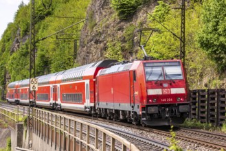 Regional express RE5 en route on the winding railway line of the Geislinger Steige. Landscape along
