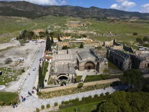 Historic stone architecture from above with surrounding landscape and tourists, Aerial view,