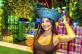 Beautiful young woman enjoying a refreshing cocktail at a vibrant brazilian carnival celebration,