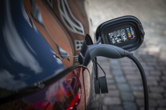 Close-up of an electric car charging at a charging station, Ringkøbing, Ringkøbing Fjord, Denmark