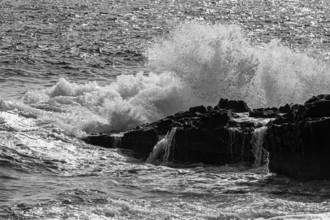 Rugged rocky coast at Stecci beach, black and white photograph, near Capoliveri, Elba Island,