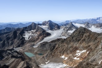 View of mountain basin with blue glacier lakes, behind summit Becher with Becherhaus, glacier