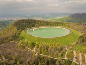 Upper reservoir, landscape with reservoir and forest on a hill, observation tower in the