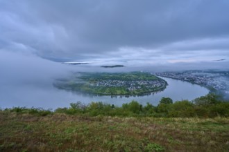 River in morning mood under cloudy sky, slightly shrouded in haze, summer, Rhine bend Boppard,