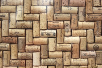 Corks from wine bottles laid as a regular pattern, wine corks, red wine
