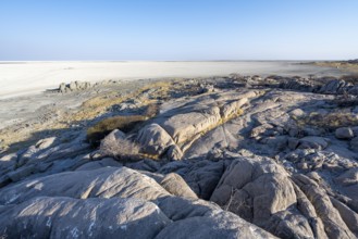 Round rocks of Kubu Island with view over the salt pan, Kubu Island (Lekubu), Sowa Pan,