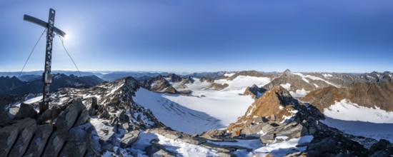 Mountain panorama at the Wilder Freiger summit with summit cross, picturesque high mountain