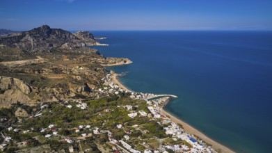 Drone shot, view of the coast from above, mountains and beach along the coastline with clear blue