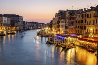 View of the Grand Canal at the blue hour, picturesque evening mood with illuminated palazzos on the