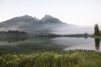 Magical sunrise with fog at Hintersee near Ramsau in Berchtesgadener Land