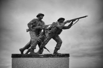 Three fighting soldiers, sculpture, British Normandy Memorial, war memorial, black and white,